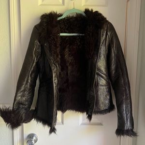 Authentic PRADA leather jacket , lamb fur inside .